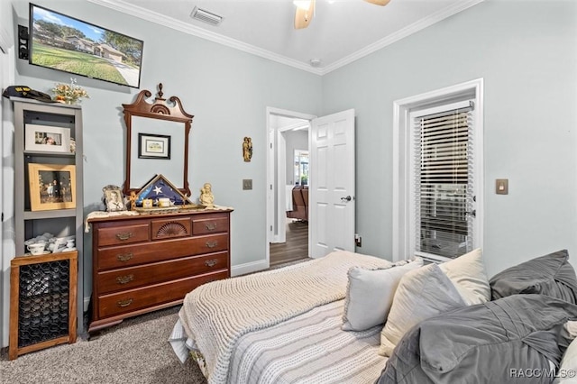 bedroom with ceiling fan, crown molding, and light carpet