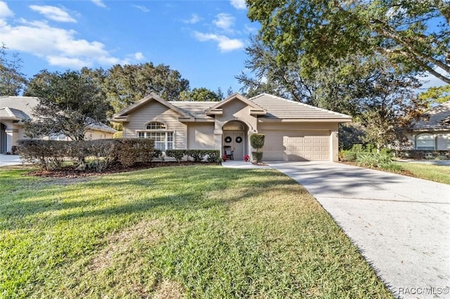 single story home with a garage and a front lawn