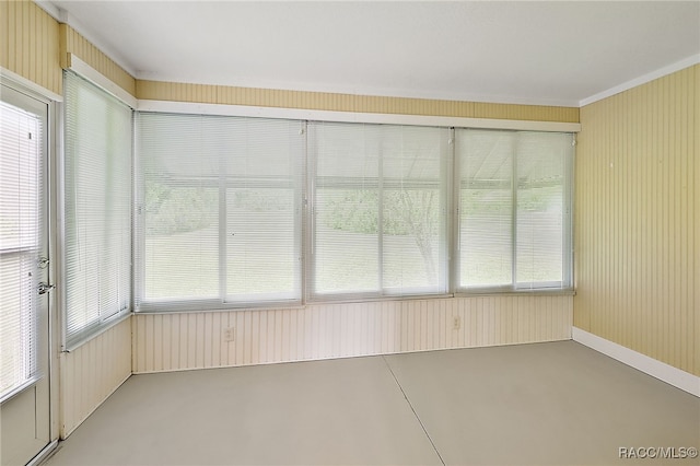 unfurnished sunroom featuring a healthy amount of sunlight