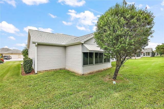 view of property exterior featuring a yard