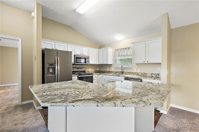 kitchen with dark colored carpet, stainless steel appliances, white cabinetry, and sink