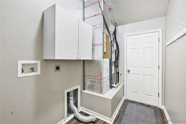 laundry area featuring washer hookup, cabinets, a textured ceiling, and hookup for an electric dryer