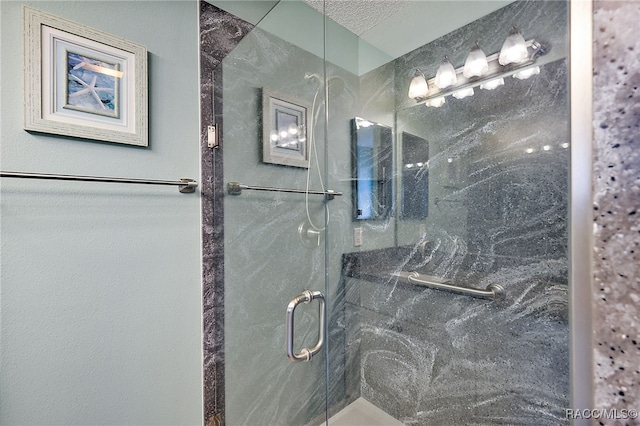 bathroom with a textured ceiling and walk in shower