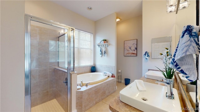 full bath with tile patterned floors, double sink, a garden tub, and a shower stall