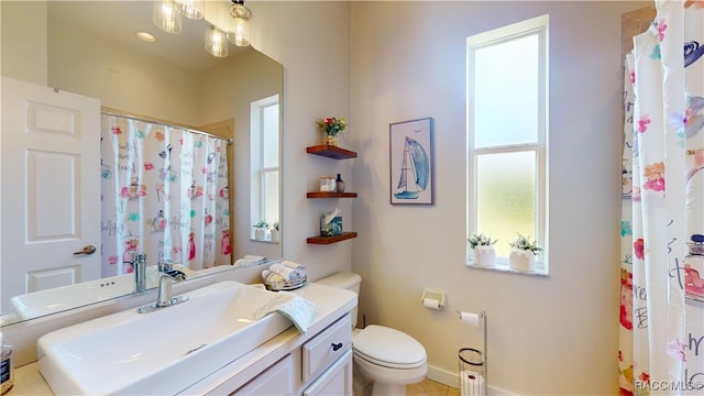 full bath with toilet, a shower with shower curtain, and vanity