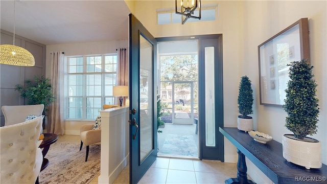 doorway featuring light tile patterned flooring