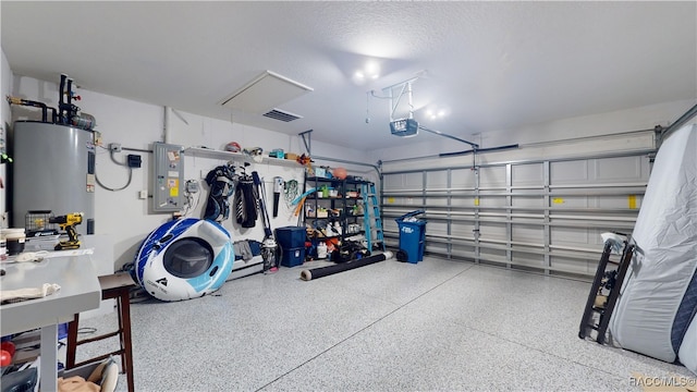 garage featuring water heater, visible vents, electric panel, and a garage door opener