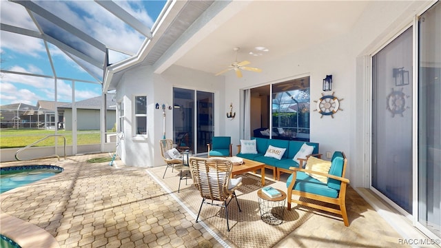 view of patio featuring a lanai, an outdoor pool, outdoor lounge area, and a ceiling fan