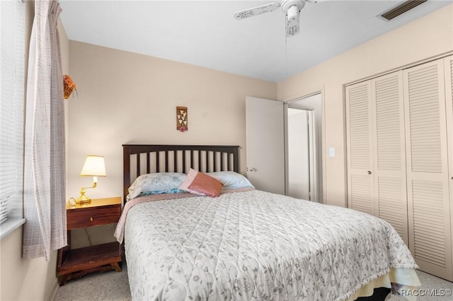 bedroom featuring ceiling fan and a closet