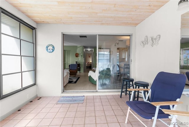 interior space with lofted ceiling and wooden ceiling