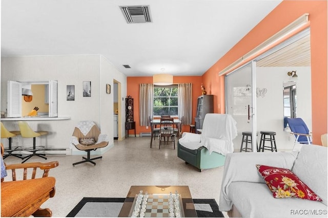 living room featuring a baseboard heating unit