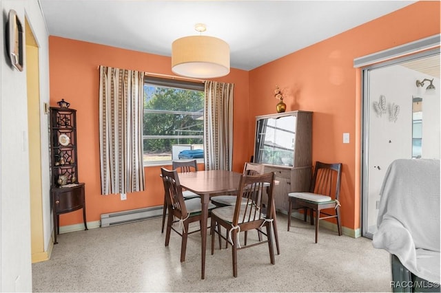 dining area featuring a baseboard radiator