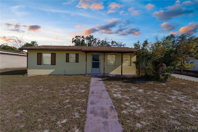 6353 Spring Hill Dr, Spring Hill, FL 34606 - view of front of house featuring stucco siding
