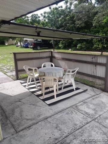6353 Spring Hill Dr, Spring Hill, FL 34606 - view of patio / terrace featuring outdoor dining space