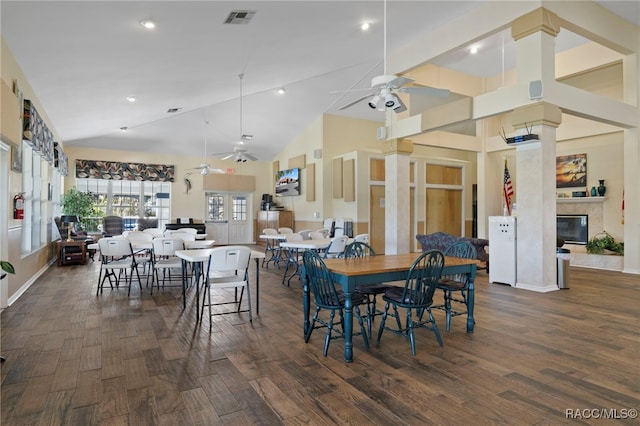 4614 N Webster Island Ter, Hernando, FL 34442 - dining area with ceiling fan, wood finished floors, vaulted ceiling, a fireplace, and recessed lighting