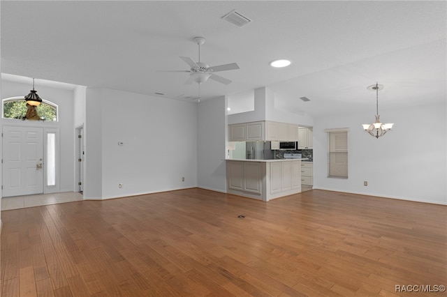 4614 N Webster Island Ter, Hernando, FL 34442 - unfurnished living room featuring a chandelier, ceiling fan, and light wood finished floors