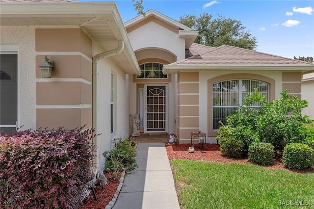 4614 N Webster Island Ter, Hernando, FL 34442 - entrance to property featuring stucco siding and roof with shingles