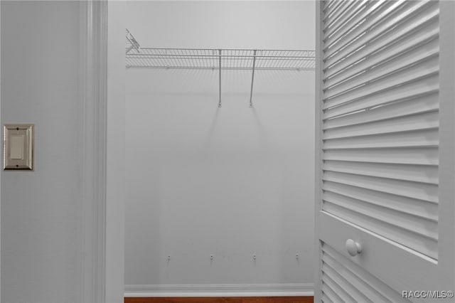 4614 N Webster Island Ter, Hernando, FL 34442 - spacious closet with dark wood-type flooring