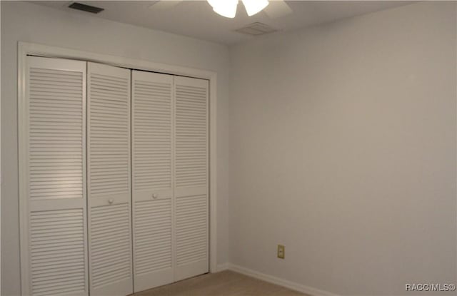 4614 N Webster Island Ter, Hernando, FL 34442 - unfurnished bedroom featuring a closet, a ceiling fan, and light colored carpet