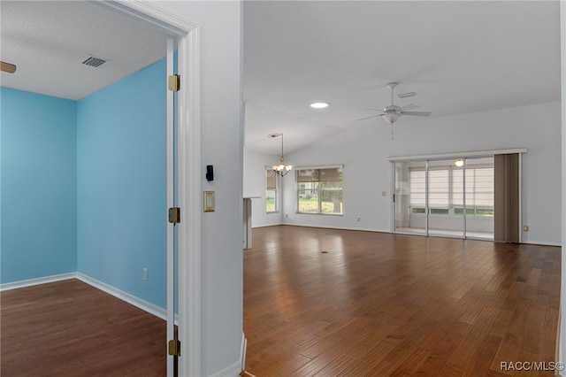 4614 N Webster Island Ter, Hernando, FL 34442 - spare room featuring ceiling fan, a chandelier, wood finished floors, and vaulted ceiling