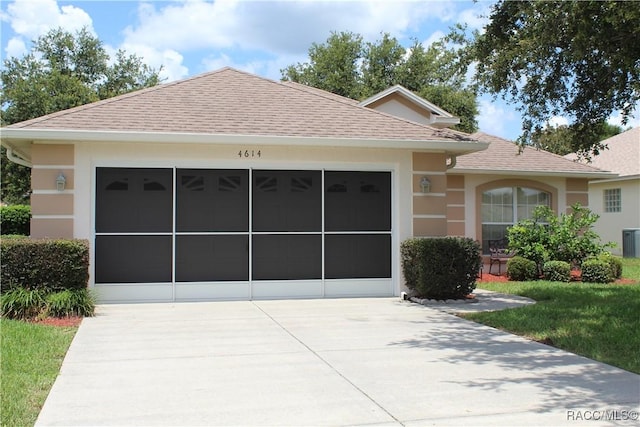 4614 N Webster Island Ter, Hernando, FL 34442 - ranch-style home with driveway, a shingled roof, stucco siding, and an attached garage