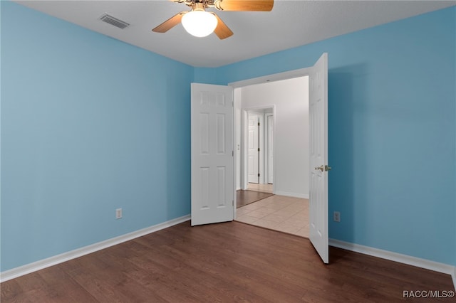 4614 N Webster Island Ter, Hernando, FL 34442 - empty room with a ceiling fan and wood finished floors