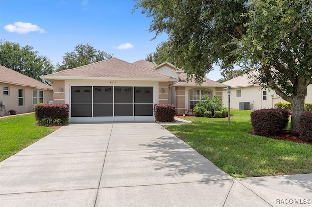 4614 N Webster Island Ter, Hernando, FL 34442 - ranch-style home with a front lawn, concrete driveway, an attached garage, and stucco siding