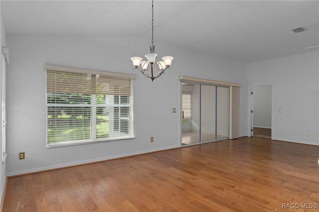 4614 N Webster Island Ter, Hernando, FL 34442 - spare room with a chandelier and wood finished floors