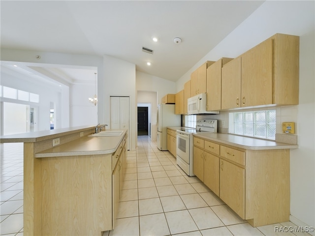 kitchen featuring light tile patterned floors, white appliances, sink, and light brown cabinetry