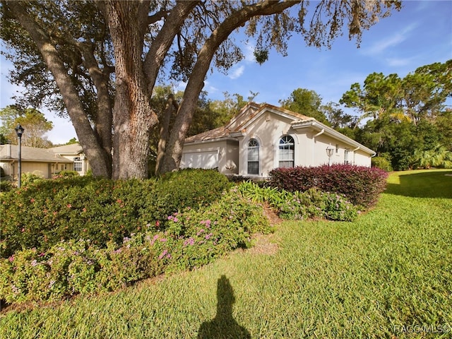 view of front of home with a front yard