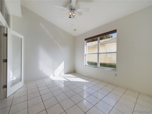 empty room featuring light tile patterned floors and ceiling fan