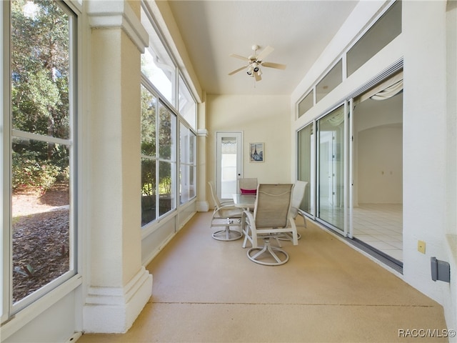 sunroom / solarium with a wealth of natural light and ceiling fan