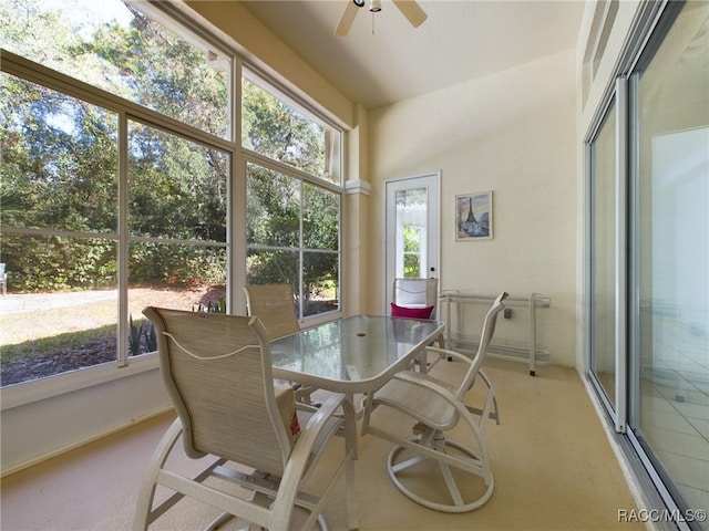 sunroom featuring ceiling fan