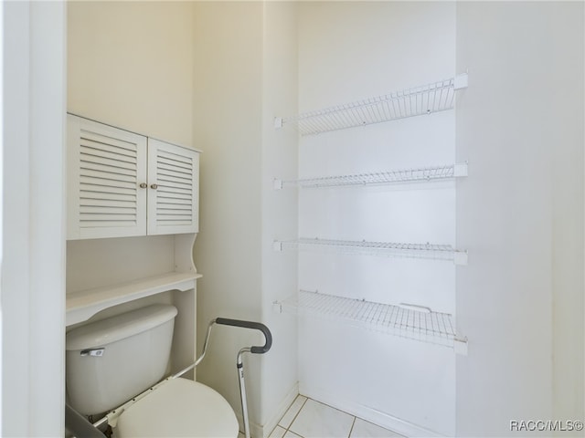 bathroom featuring tile patterned floors and toilet