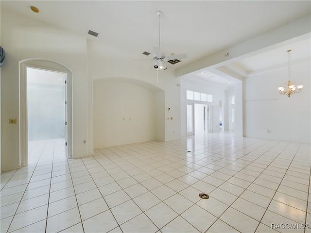 spare room with light tile patterned floors and ceiling fan with notable chandelier