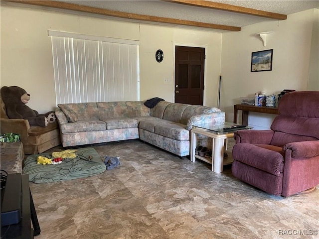 living room featuring a textured ceiling and beam ceiling