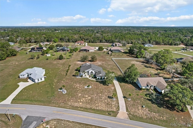 aerial view with a wooded view