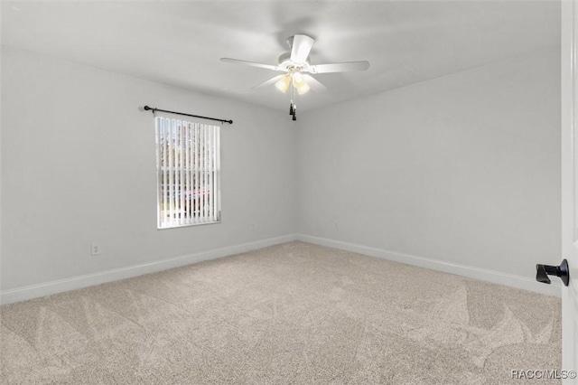 unfurnished room featuring ceiling fan, carpet flooring, and baseboards