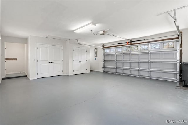 garage featuring baseboards and a garage door opener