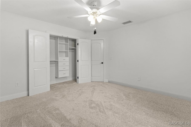 unfurnished bedroom with a ceiling fan, visible vents, baseboards, a closet, and carpet