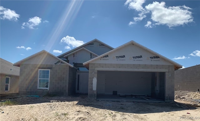 property under construction featuring a garage