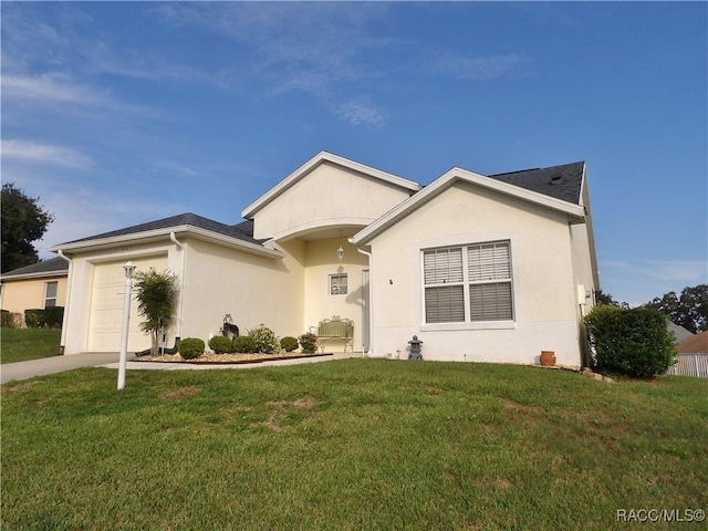 single story home featuring a garage and a front yard