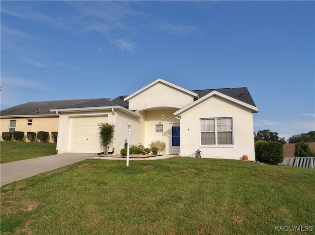 single story home featuring a garage and a front yard