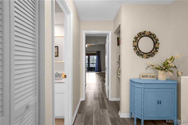 corridor featuring dark wood-type flooring