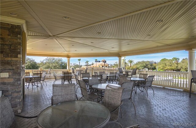 view of property's community featuring a water view and a yard