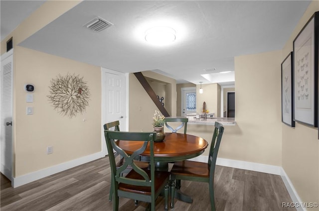 dining area featuring dark hardwood / wood-style flooring and sink