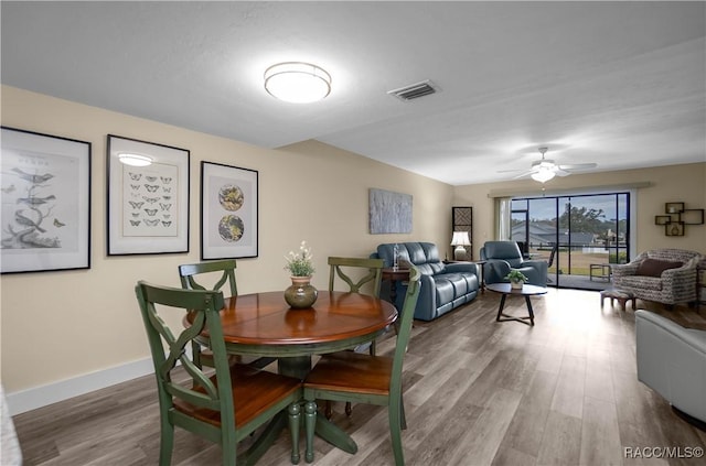 dining area featuring ceiling fan and hardwood / wood-style floors