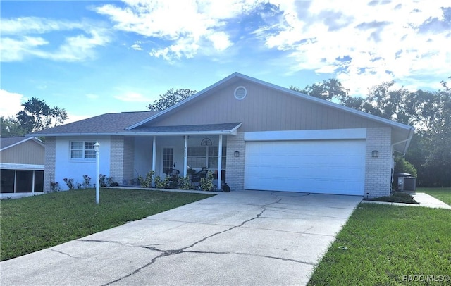 3526 N Tamarisk Ave, Beverly Hills, FL 34465 - ranch-style house with brick siding, a front yard, a garage, concrete driveway, and a porch