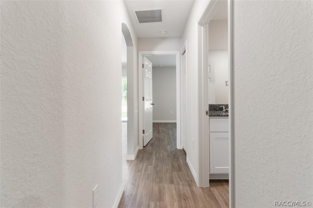 corridor featuring light wood-type flooring