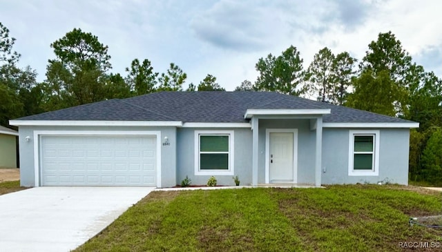 ranch-style house with a garage and a front lawn